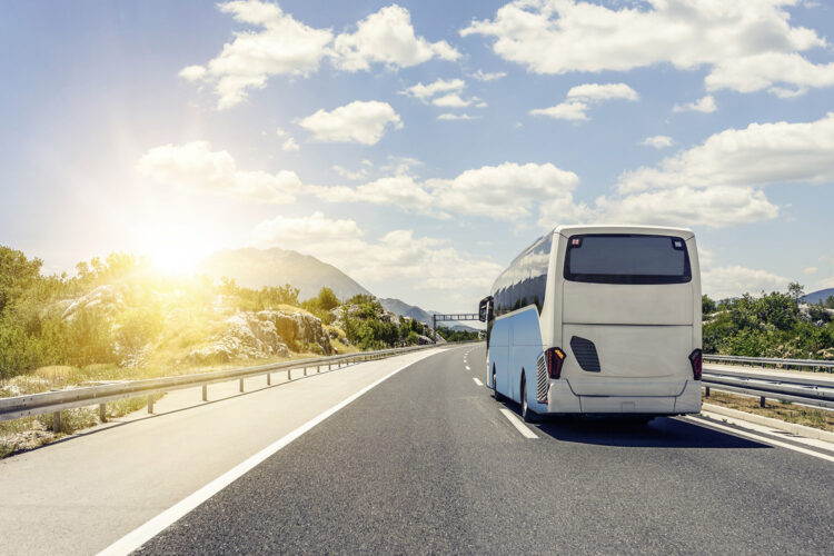 Bus rushes along the asphalt high-speed highway